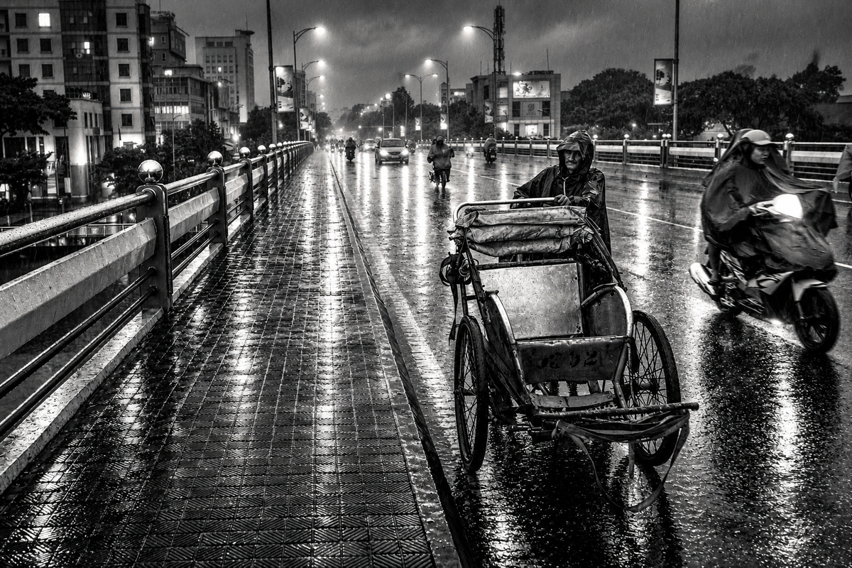 Moody black and white photography of cyclo driver pushing rickshaw across wet bridge on rainy night in Vietnam wall art print